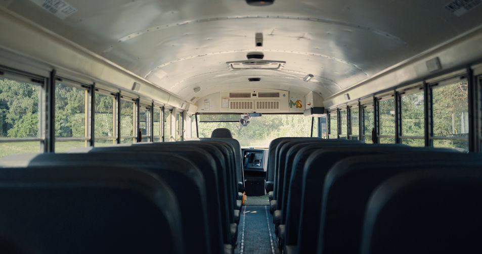 old, worn school bus seats